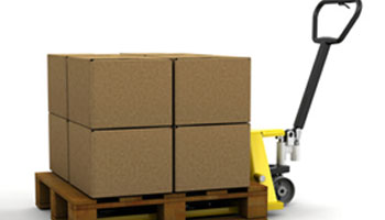 A forklift is loading boxes on to the pallet.